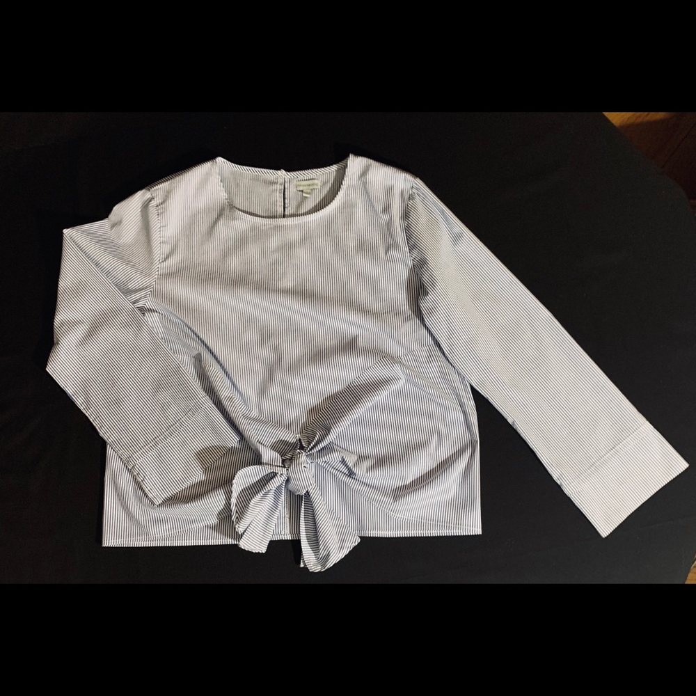 Blue/white striped shirt with bow accent at waist
